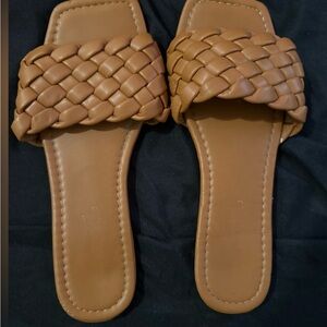 Tan flat braided slip on sandal
